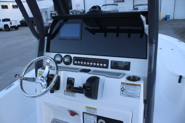 2025 Sea Fox 231 Bay Fox boat dashboard with steering wheel and control panel.