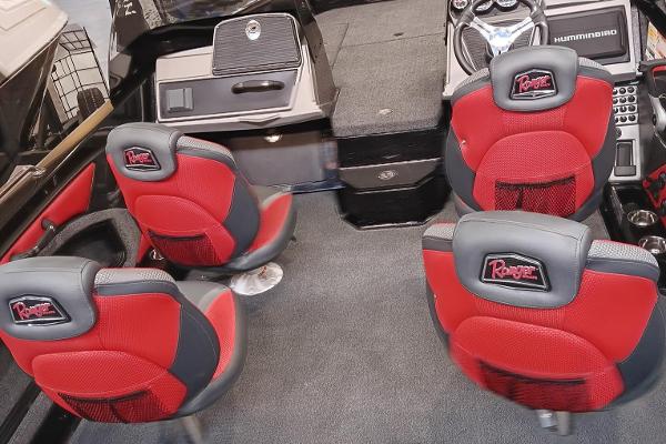 2025 Ranger 1880MS boat interior with red and gray seating and advanced dashboard controls.