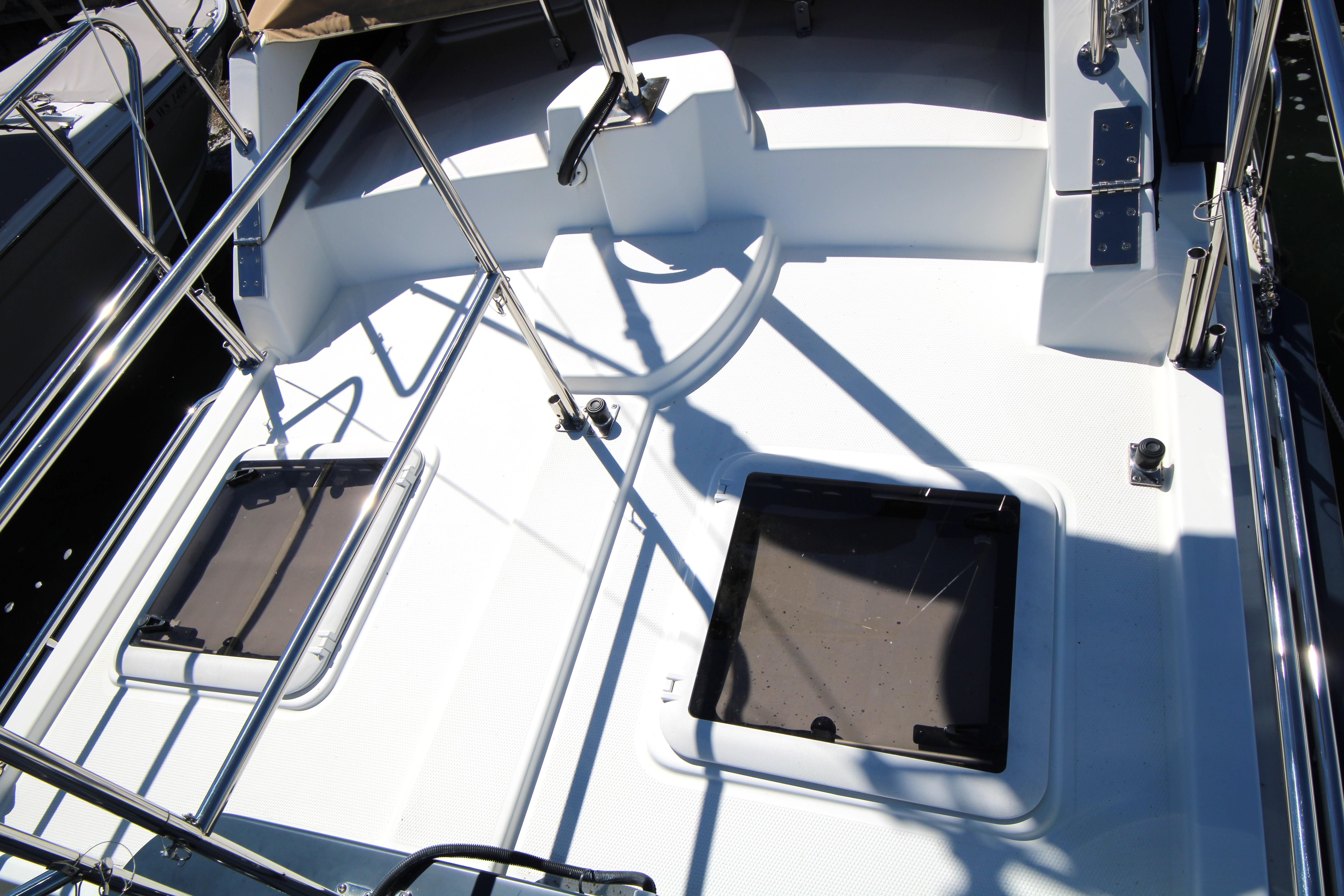 2013 Ranger Tugs R-31 CB boat deck with stainless steel railings and hatches.
