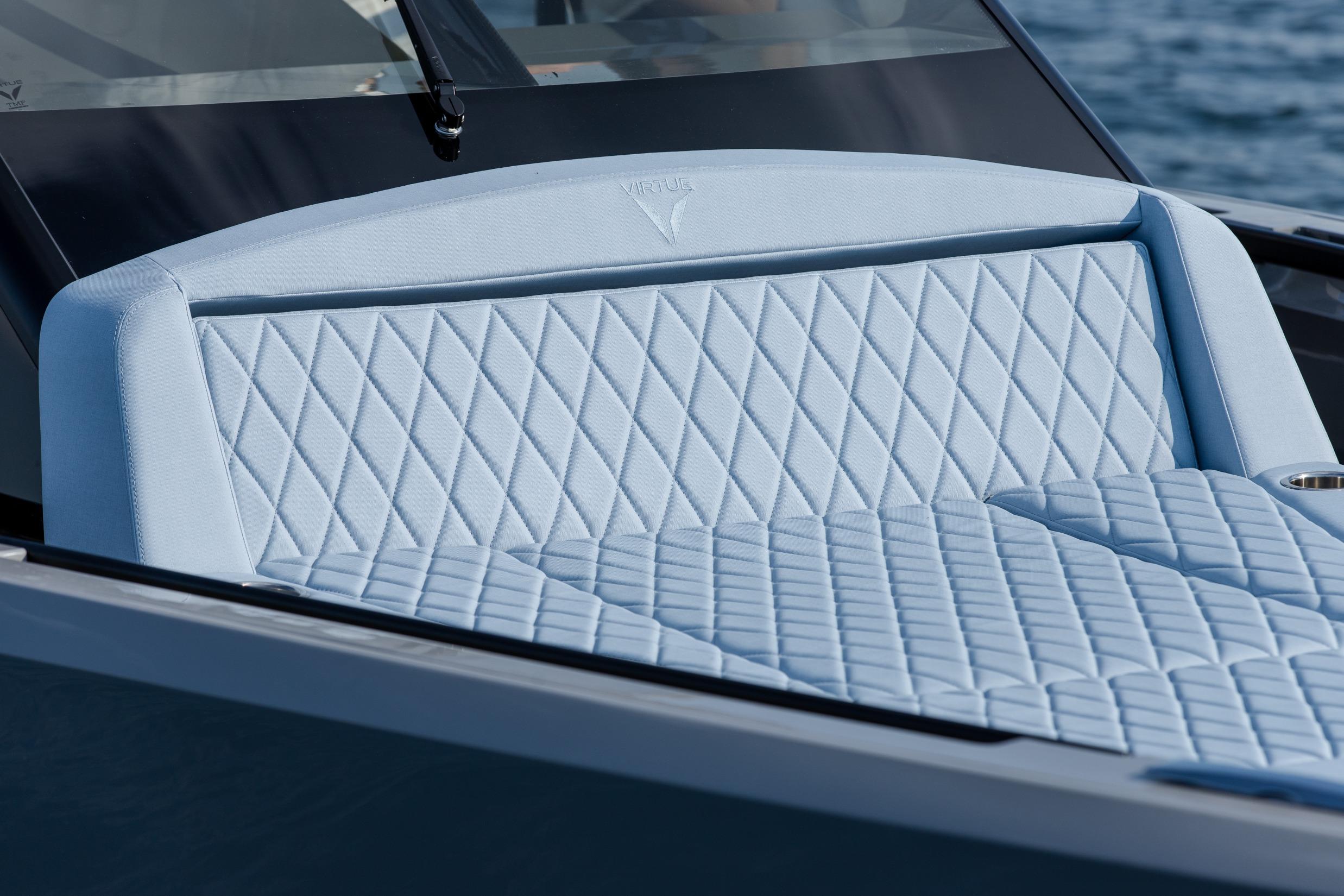 Luxurious seating on the 2027 Virtue V10 Top boat, featuring elegant diamond stitching.