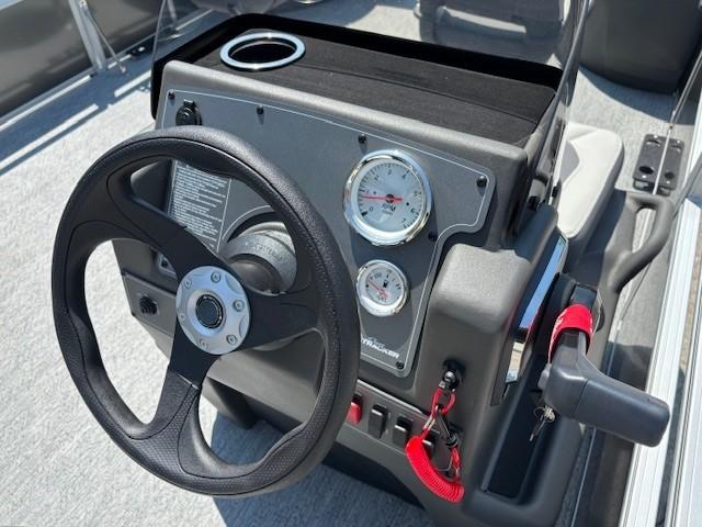 Steering console of 2026 Sun Tracker Bass Buggy 18 DLX pontoon boat.