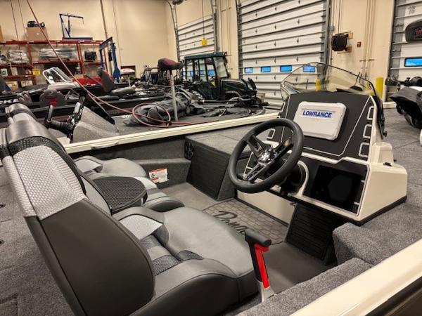 Interior of 2025 Ranger ALPHA 208 boat with steering wheel and Lowrance display.