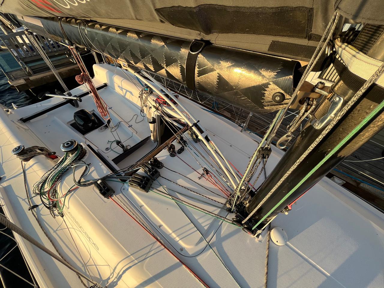 Sailboat deck with rigging and ropes, Seascape 27, 2018 model, docked at sunset.