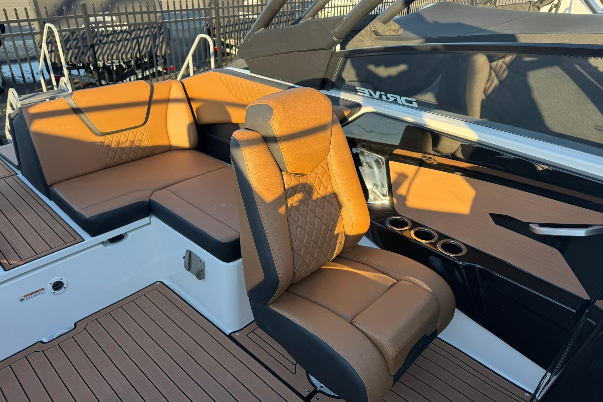 2026 Yamaha Boats 222SD interior with tan leather seating and modern design.
