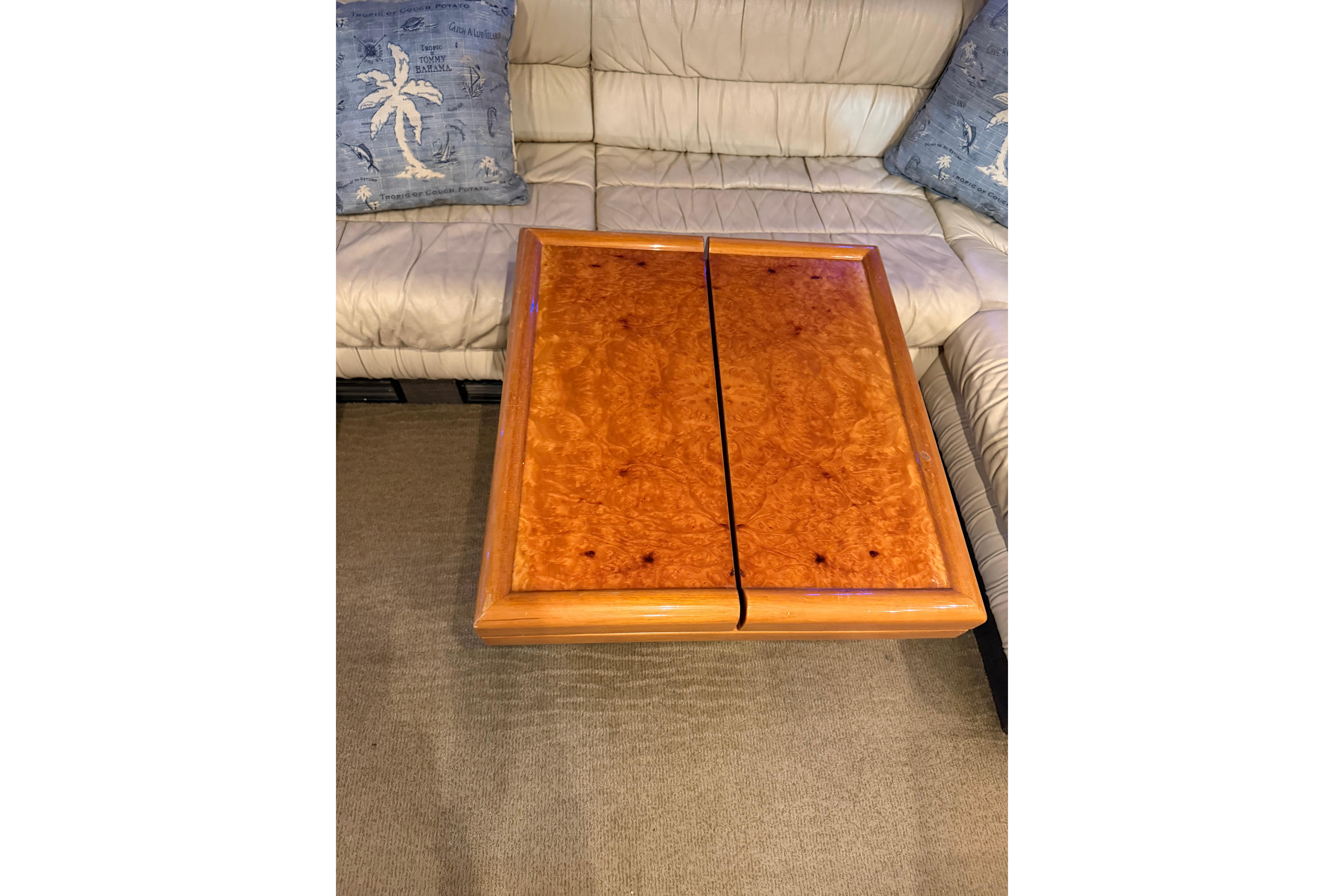 Luxurious wooden table on Ferretti Yachts 185 Fly, 1994 model, with plush seating.