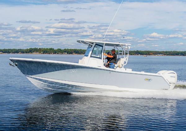 Manufacturer Provided Image: 2026 Sea Hunt Gamefish 28 Coffin Box cruising on a calm lake under a partly cloudy sky.