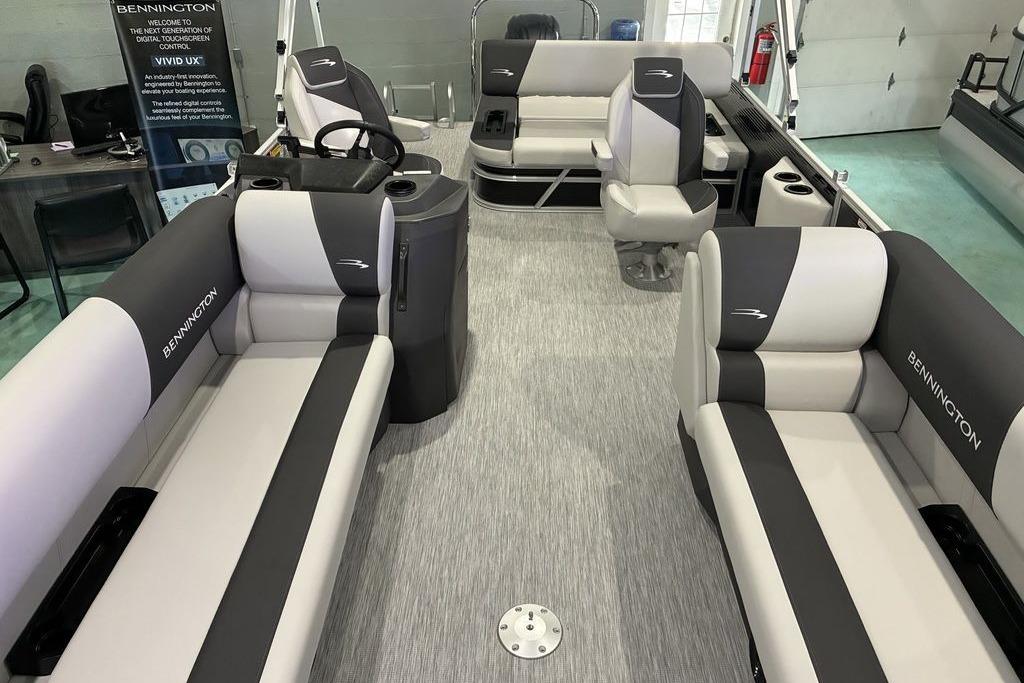 2026 Bennington SWINGBACK 22 boat interior with gray and black seating, modern design.