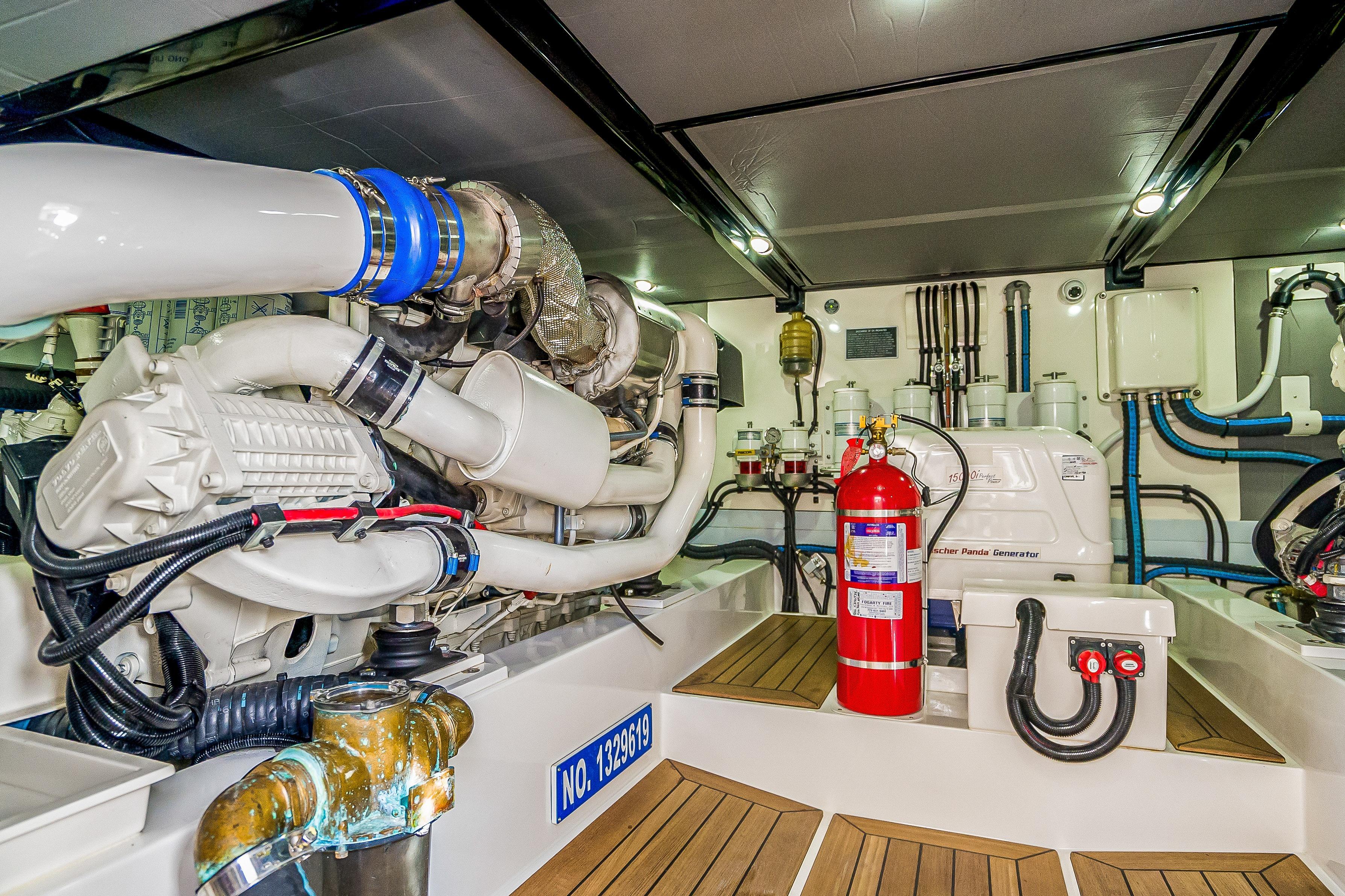 Engine room of 2023 Grand Banks GB54 yacht, featuring advanced machinery and safety equipment.