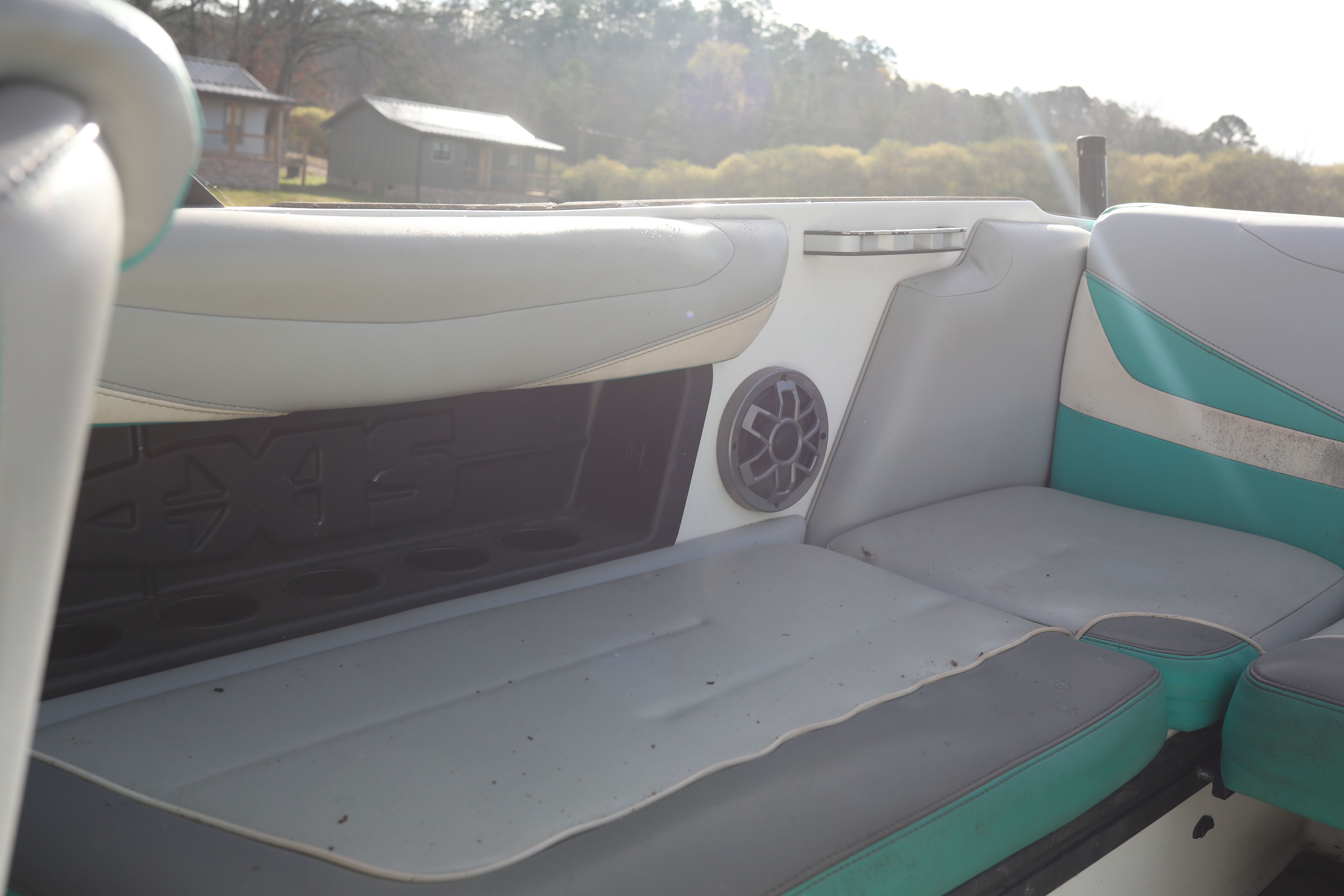 Interior of a 2019 Axis T22 boat with gray and teal seating.