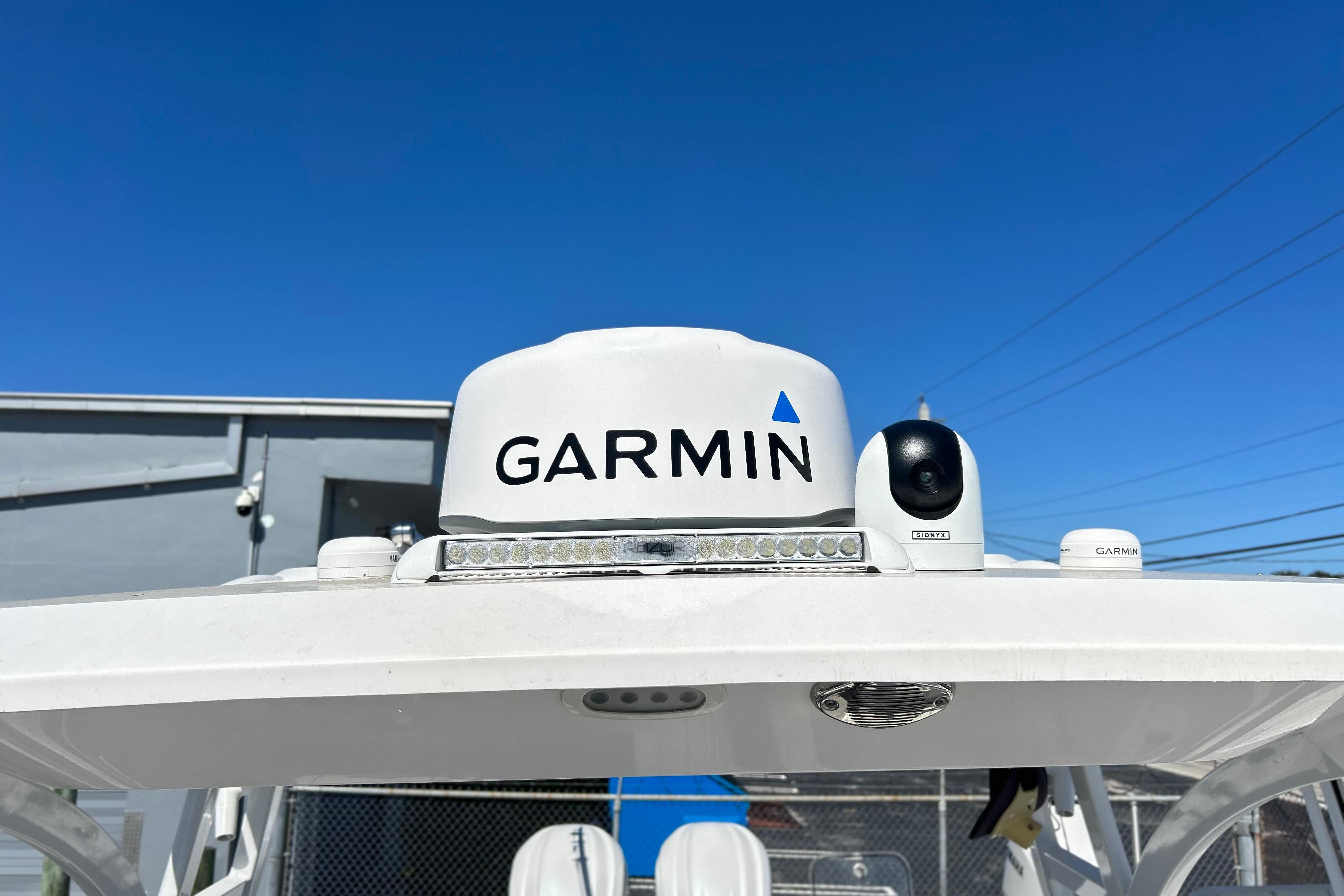 Garmin equipment on 2025 Sea Fox 288 Traveler boat against clear blue sky.