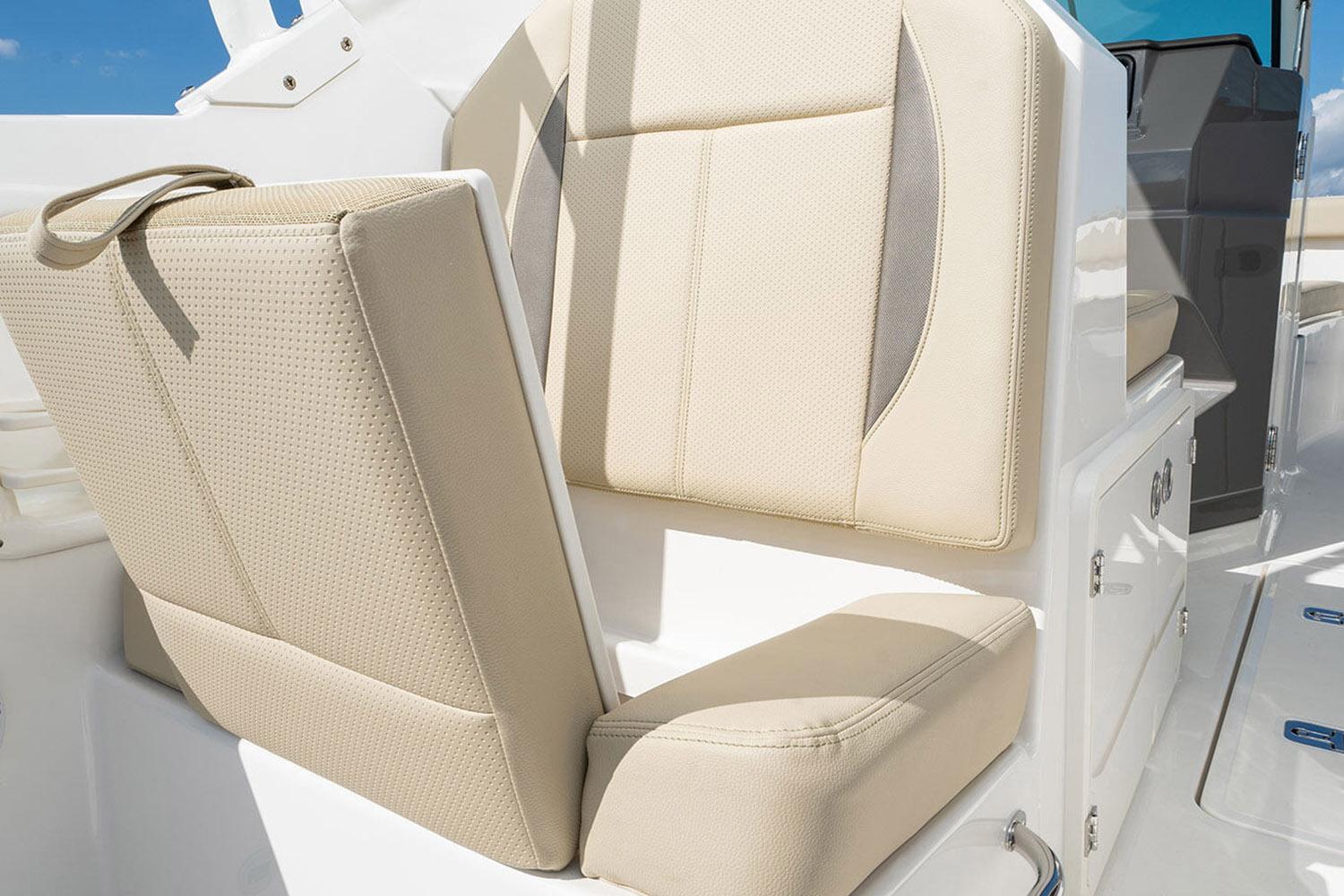 Manufacturer Provided Image: 2025 Pursuit DC 266 Dual Console boat seat, beige upholstery, modern design.