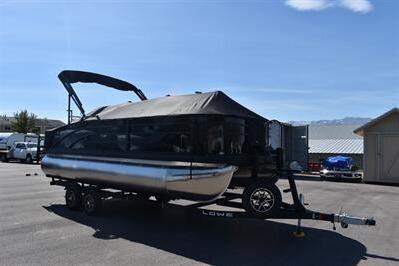 2026 Lowe SF 214 Sport Fish pontoon boat on trailer in sunny parking lot.