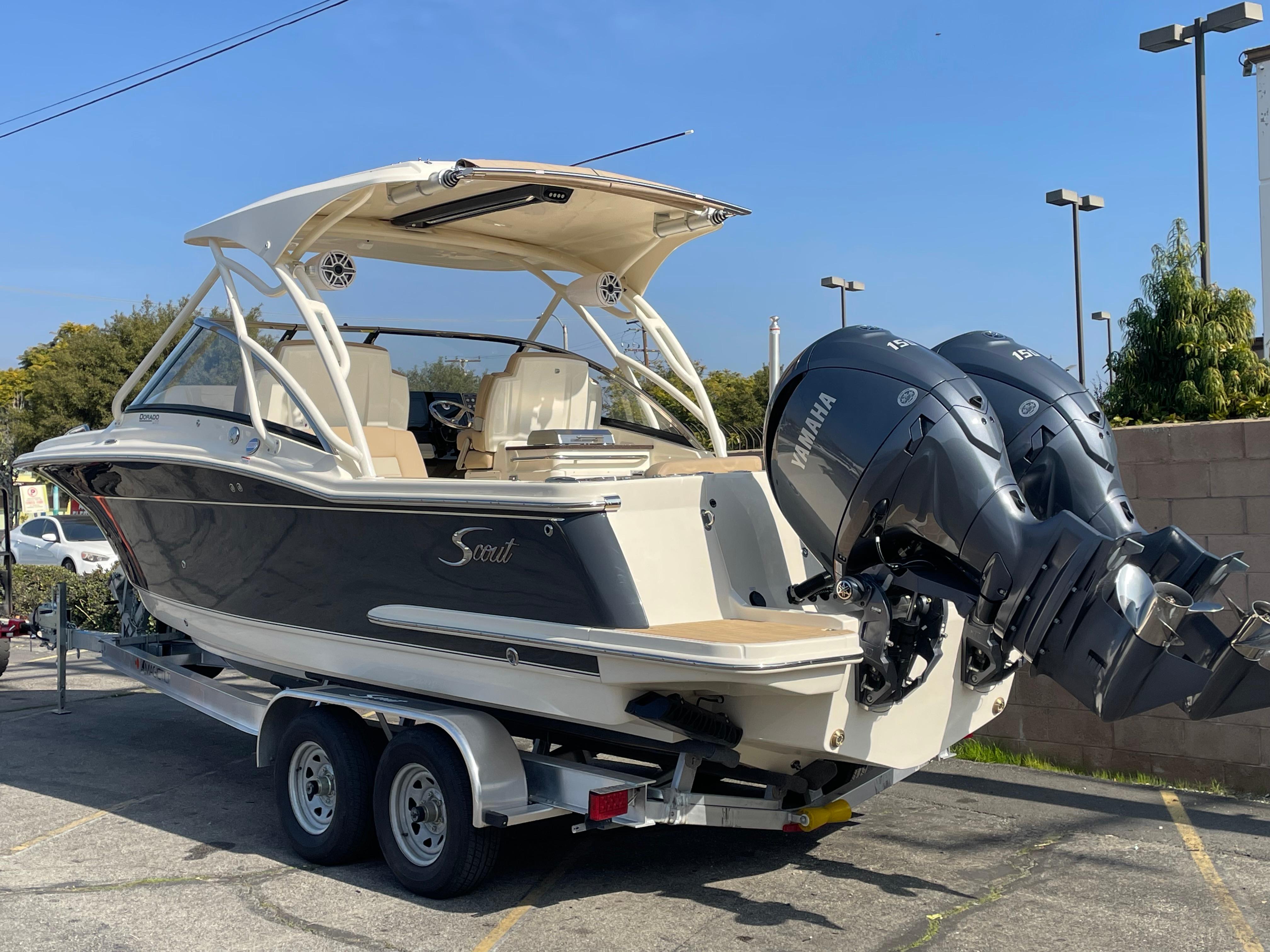 2024 Scout 255 Dorado boat on trailer with dual Yamaha outboard engines.
