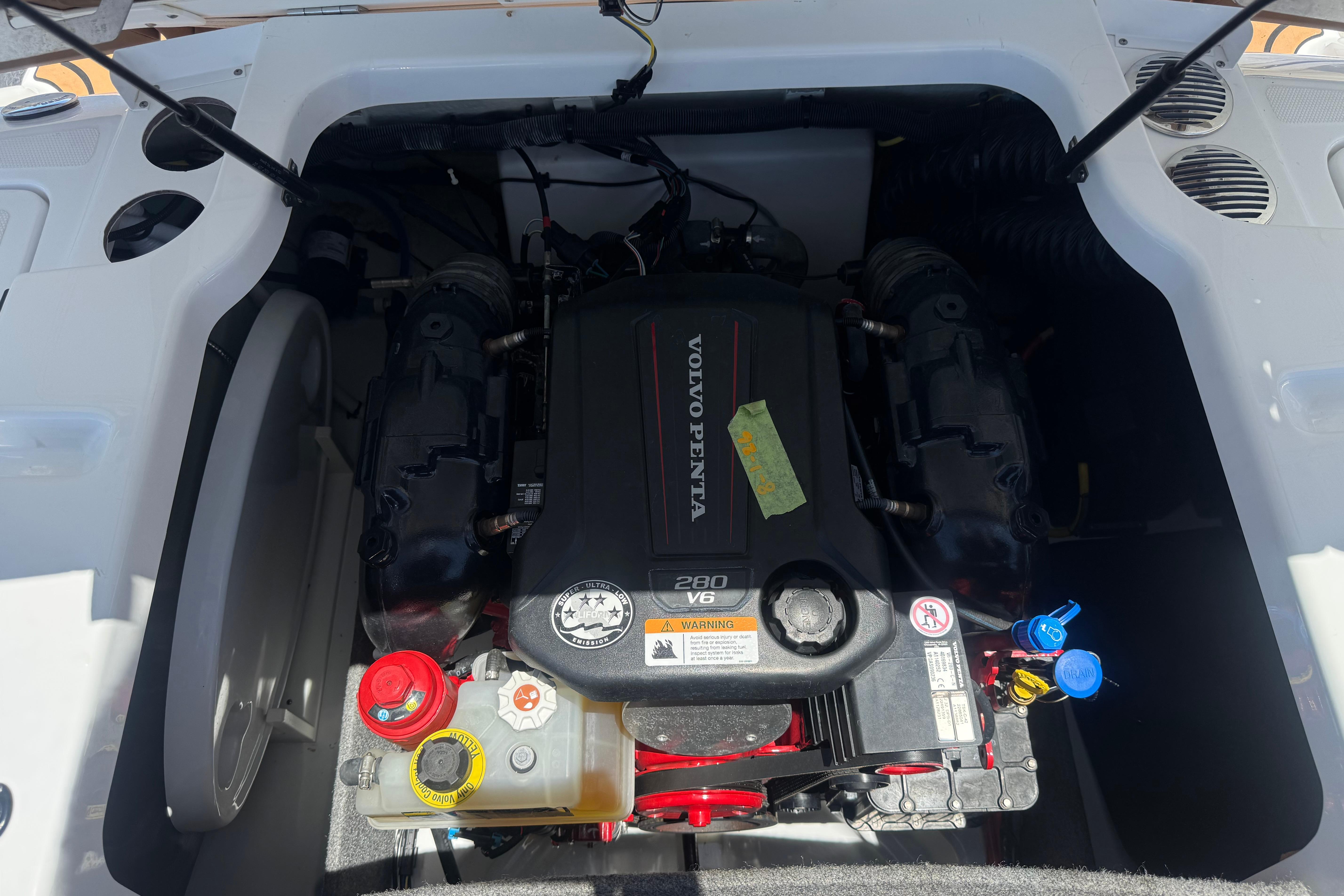 Engine compartment of 2022 Four Winns H4 boat with Volvo Penta 280 V6 engine.