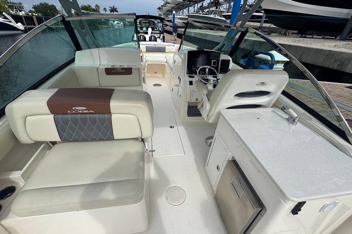 2020 Cobia 280 Dual Console boat interior with seating and helm station.