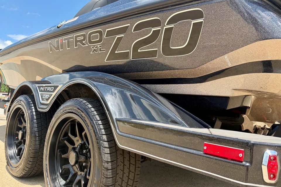 2026 Nitro Z20 XL Pro boat trailer with sleek black design and dual wheels.