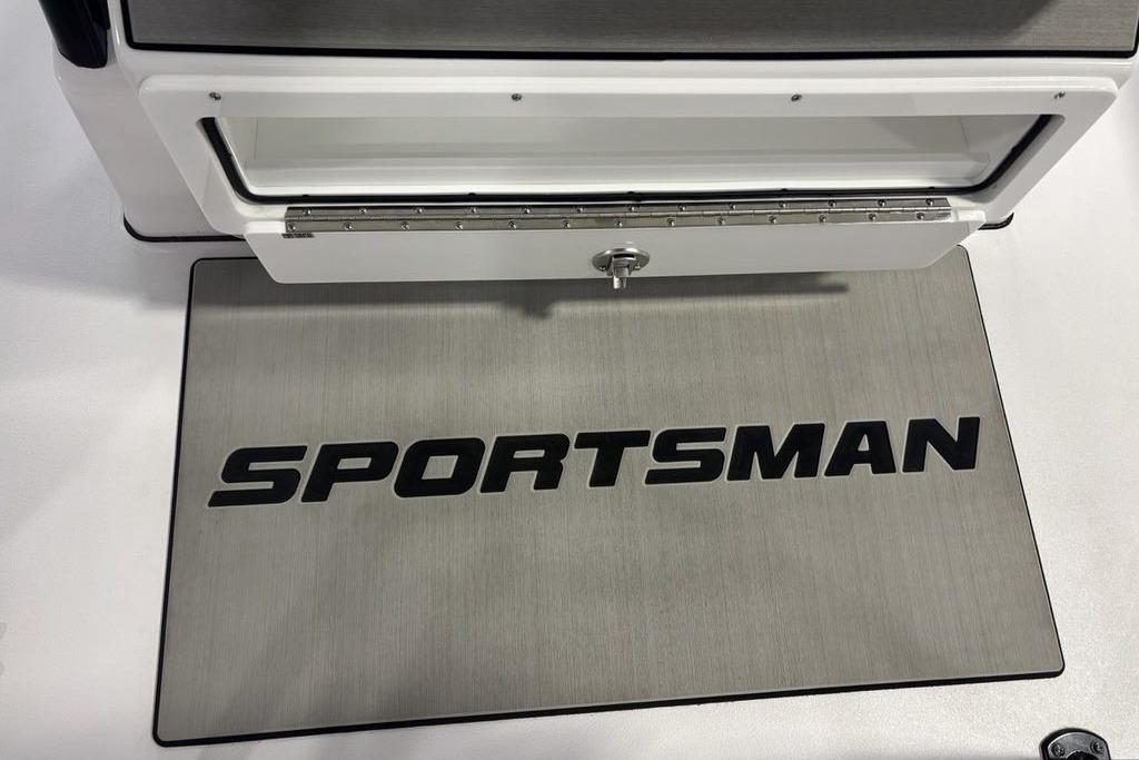 2026 Sportsman Masters 247 Bay Boat deck with open storage compartment.