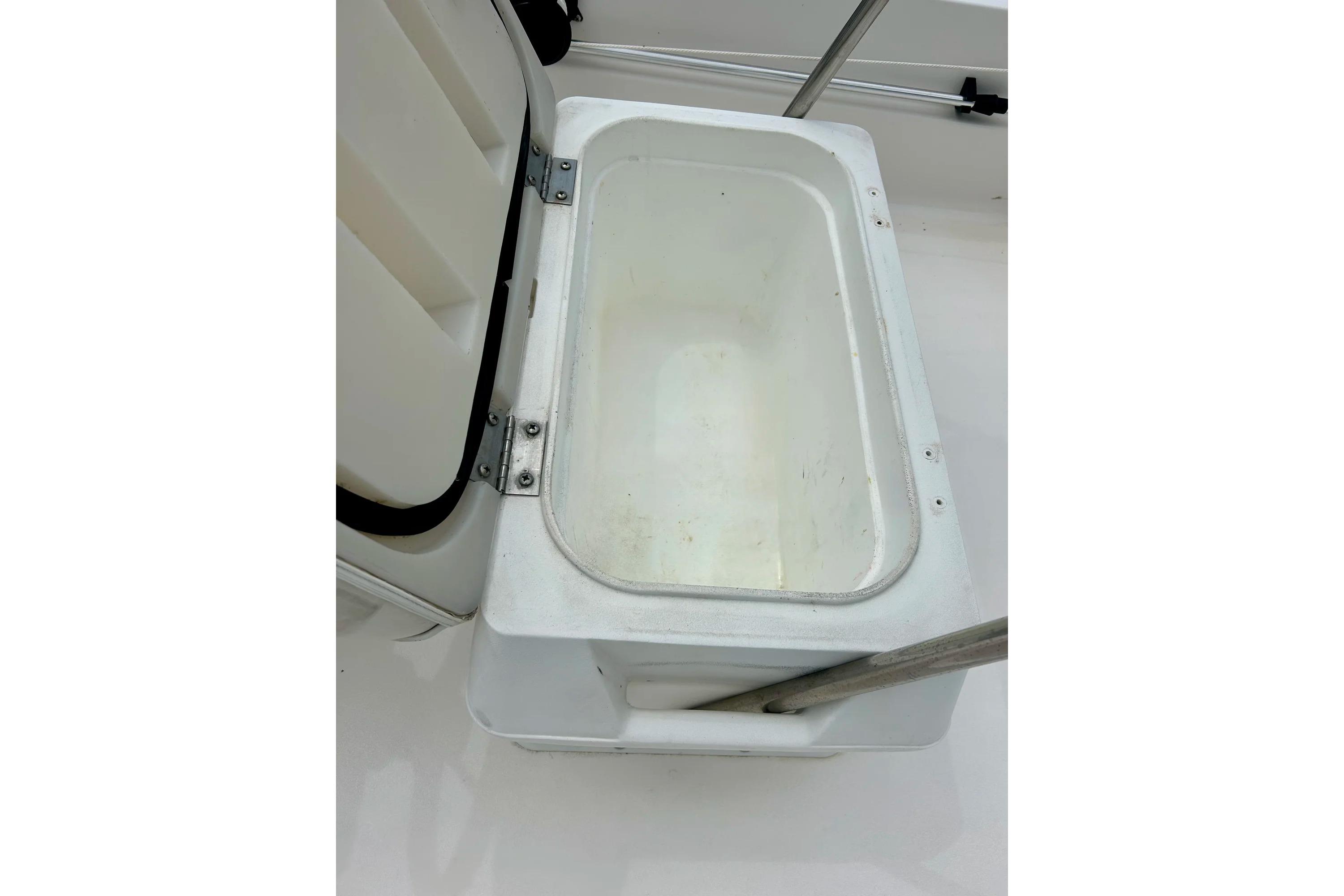 Open storage compartment on 1997 Wellcraft 160 Fisherman boat, showcasing interior space.