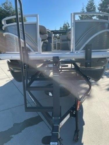 2024 Sun Tracker Fishin' Barge 20 DLX pontoon boat on trailer.
