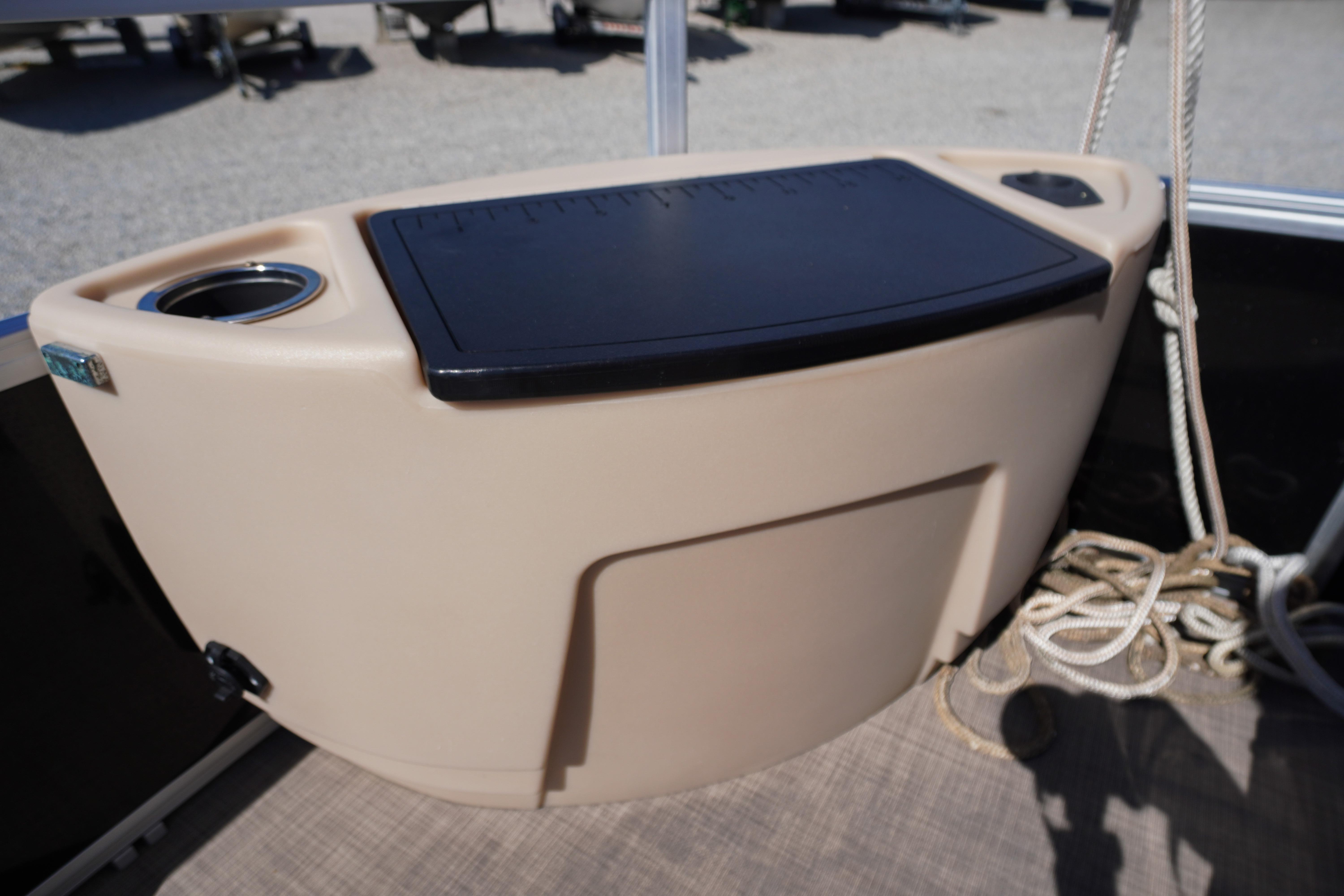 2019 SUNTRACKER Fishin' Barge 22 DLX boat console with cup holders and storage.