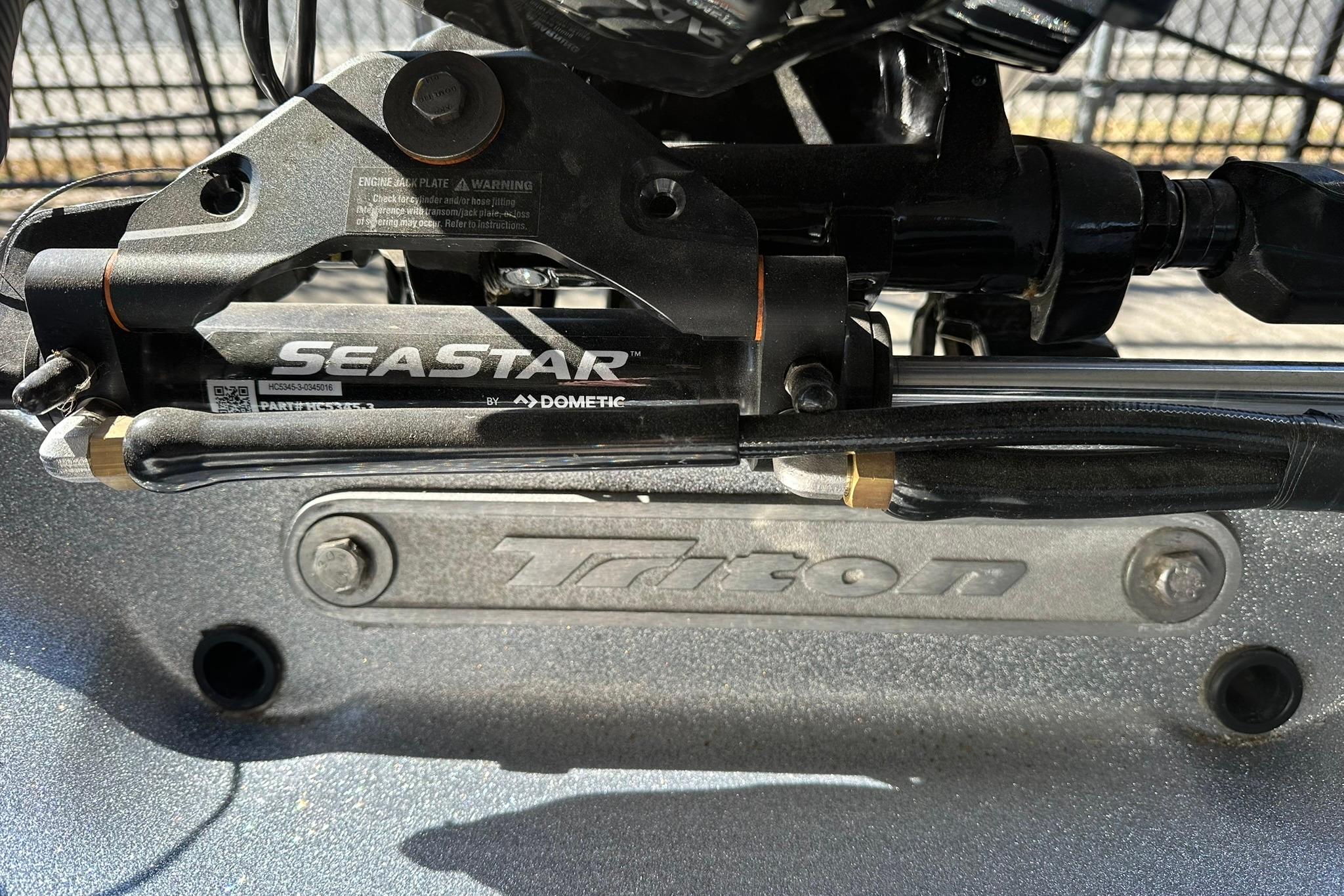 Close-up of 2026 Triton 179 TrX boat with SeaStar hydraulic steering system.