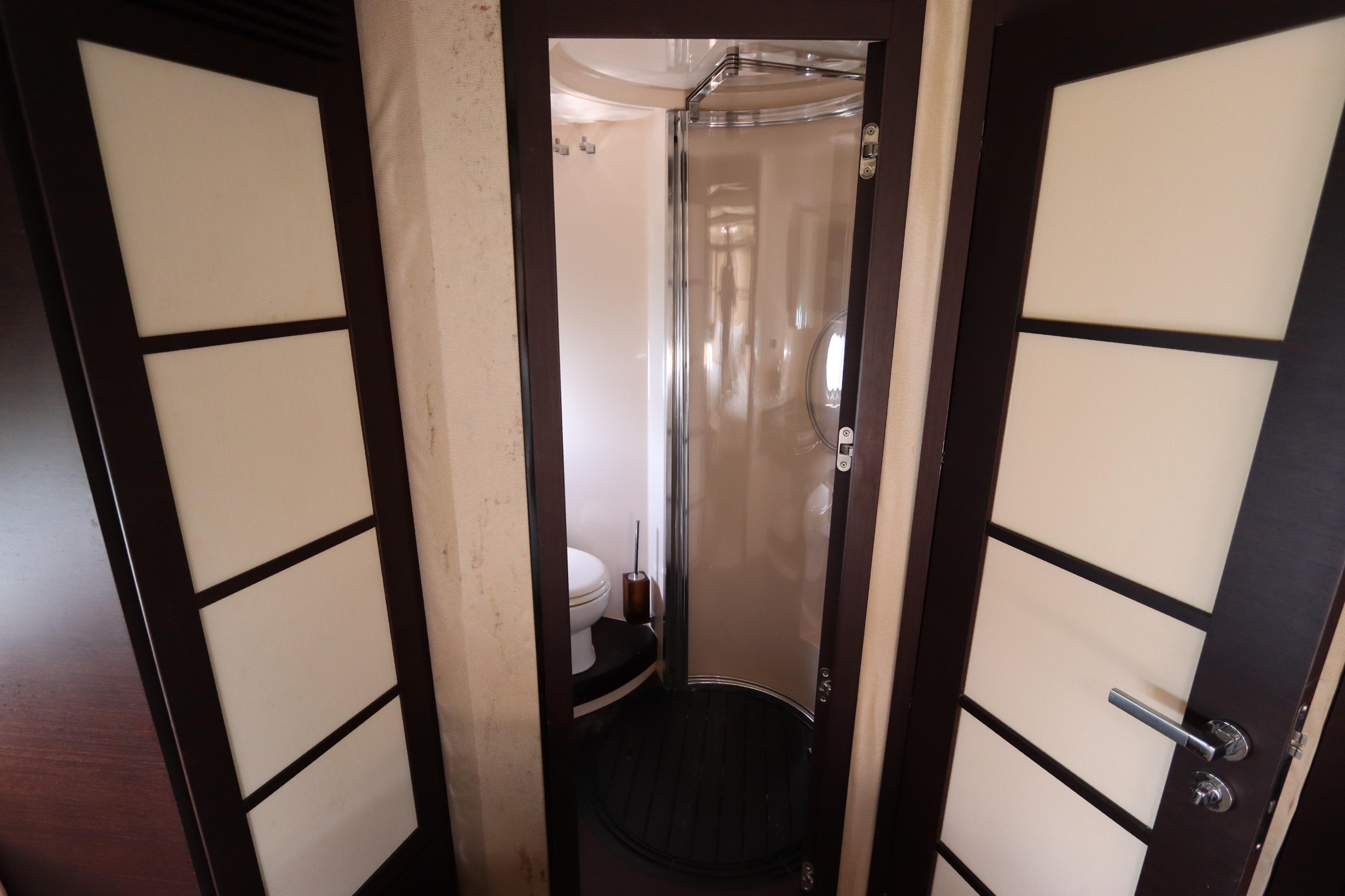 Bathroom interior of 2007 Azimut 62S yacht with modern design and shower.