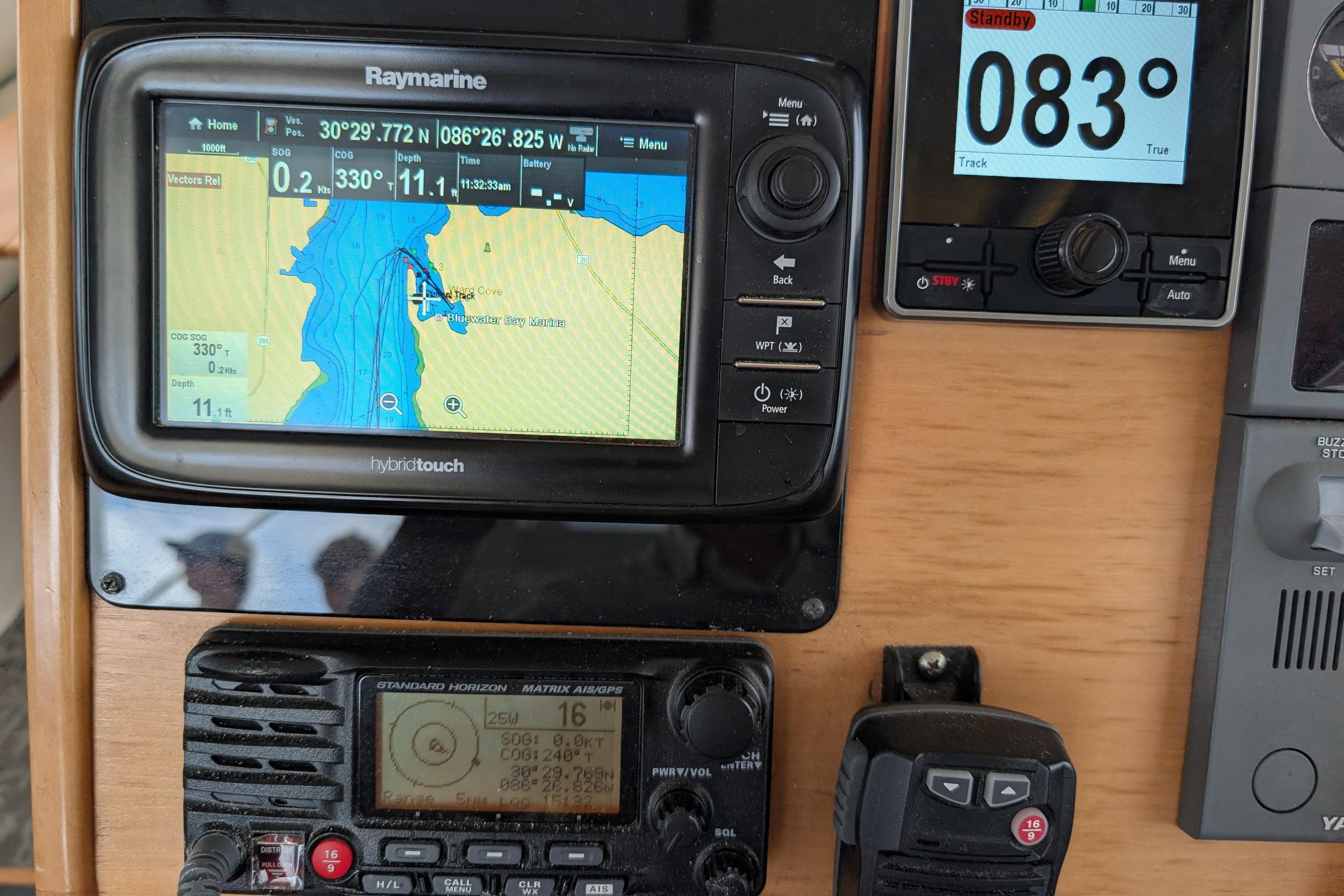 Navigation equipment on a 2004 PDQ 34 Powercat, featuring Raymarine display and controls.