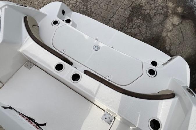 2026 Yamaha Boats 222 FSH Sport E, white deck with cup holders and storage compartments.