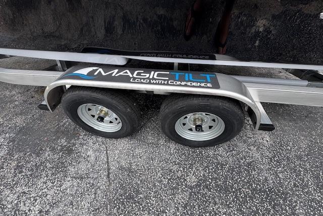 Trailer for 2026 Sea Chaser 26 LX boat with Magic Tilt branding.