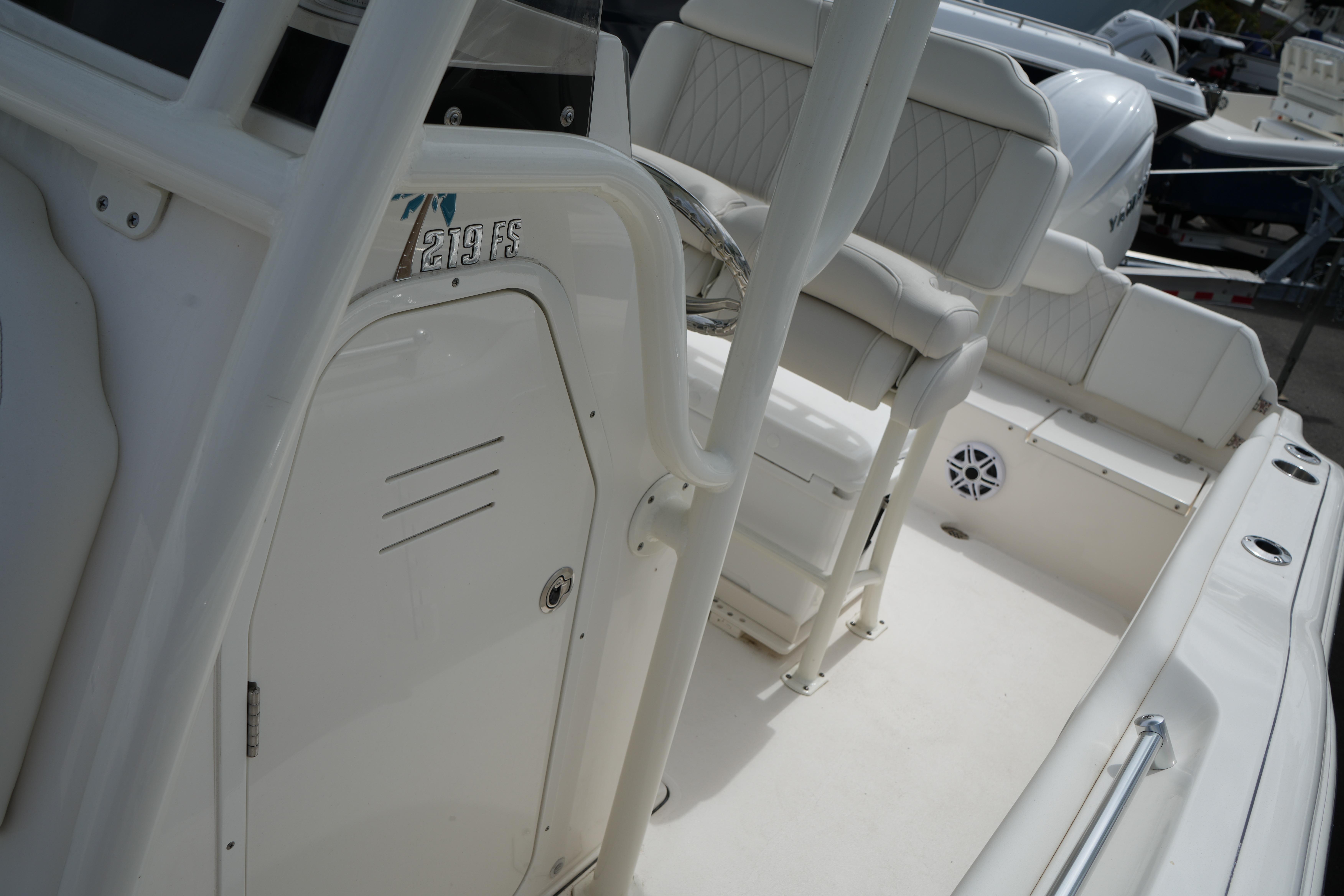 2026 Key West 219 FS boat interior with seating and steering console.