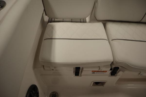 2025 Sea Fox 228 Traveler boat seating with white cushions.