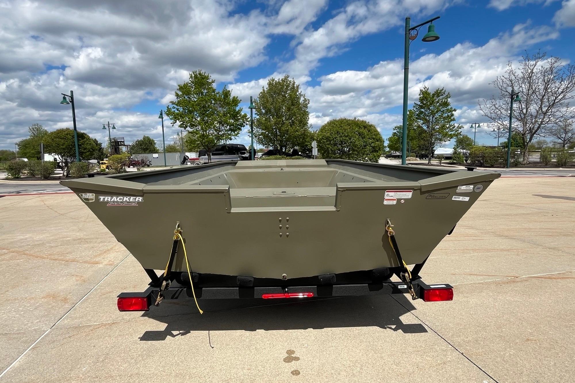 2026 Tracker Grizzly 2072 Utility boat on trailer, parked outdoors under a cloudy sky.