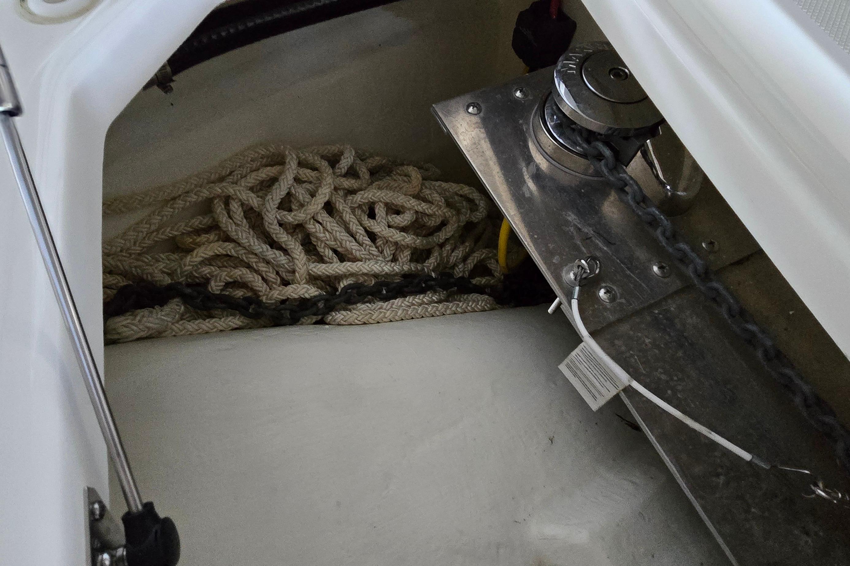 Anchor storage compartment in 2024 WorldCat 280 CC-X boat with rope and chain.