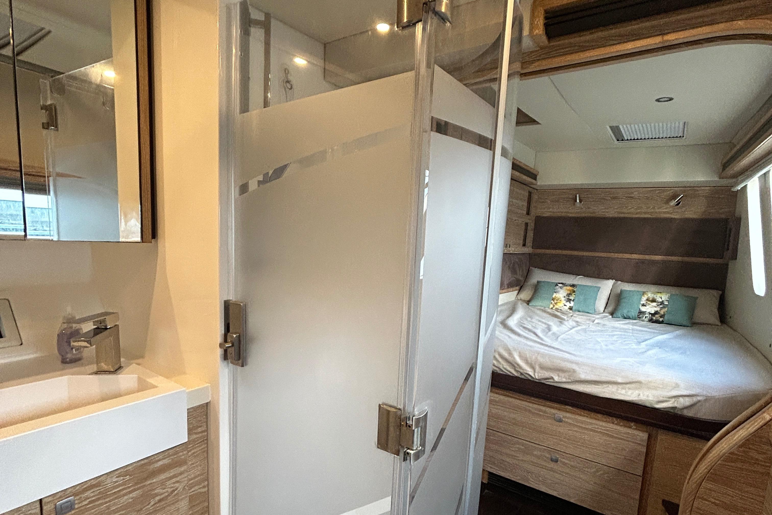 Luxurious 2019 Xquisite Yachts X5 interior with modern bathroom and cozy bedroom.