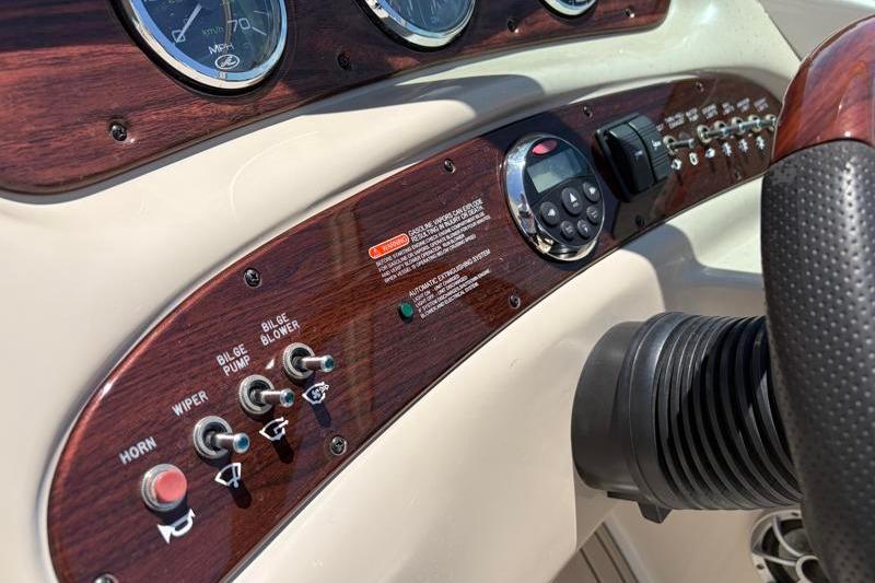 Dashboard of a 2007 Sea Ray 240 Sundeck boat with controls and gauges.