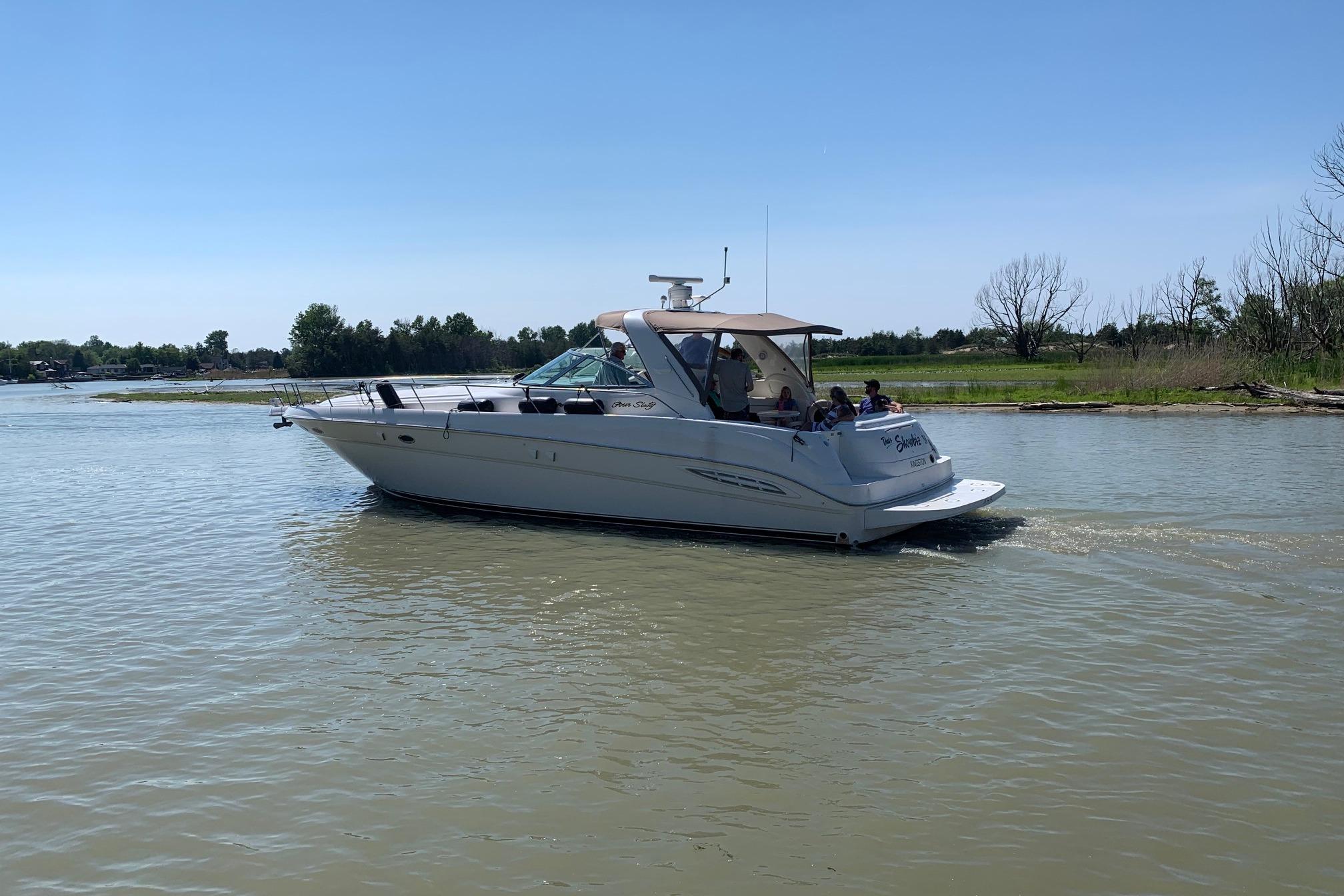 1999 Sea Ray Sundancer 460 cruising on calm waters.