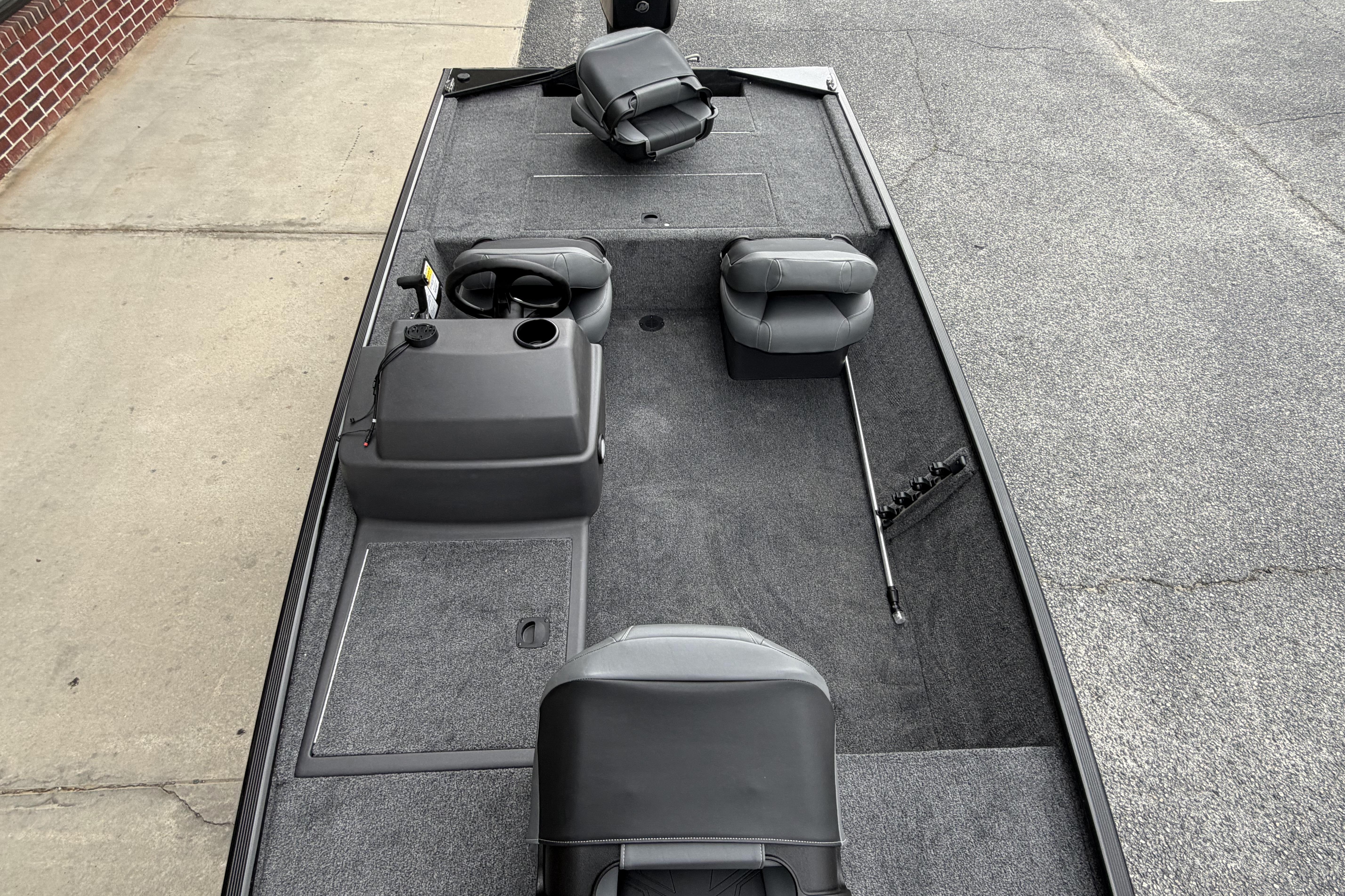 2026 Tracker Bass Tracker Classic XL boat interior with seating and steering console.