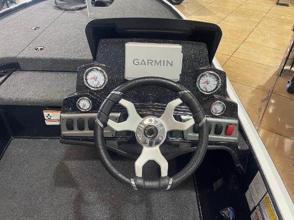 Steering console of 2025 Nitro Z18 Pro boat with Garmin display and gauges.