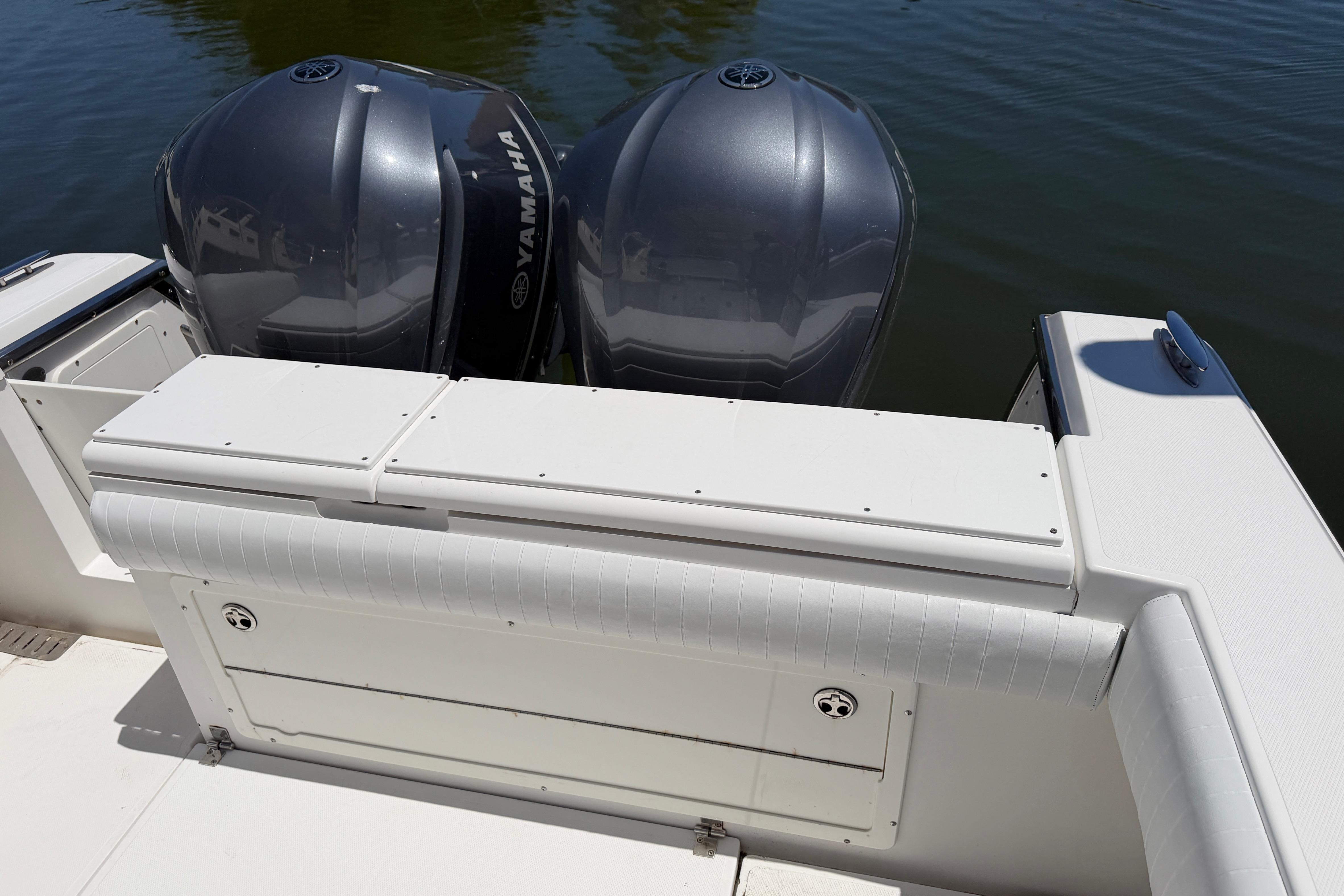 2006 Southport 26 Center Console boat with dual Yamaha engines on calm water.