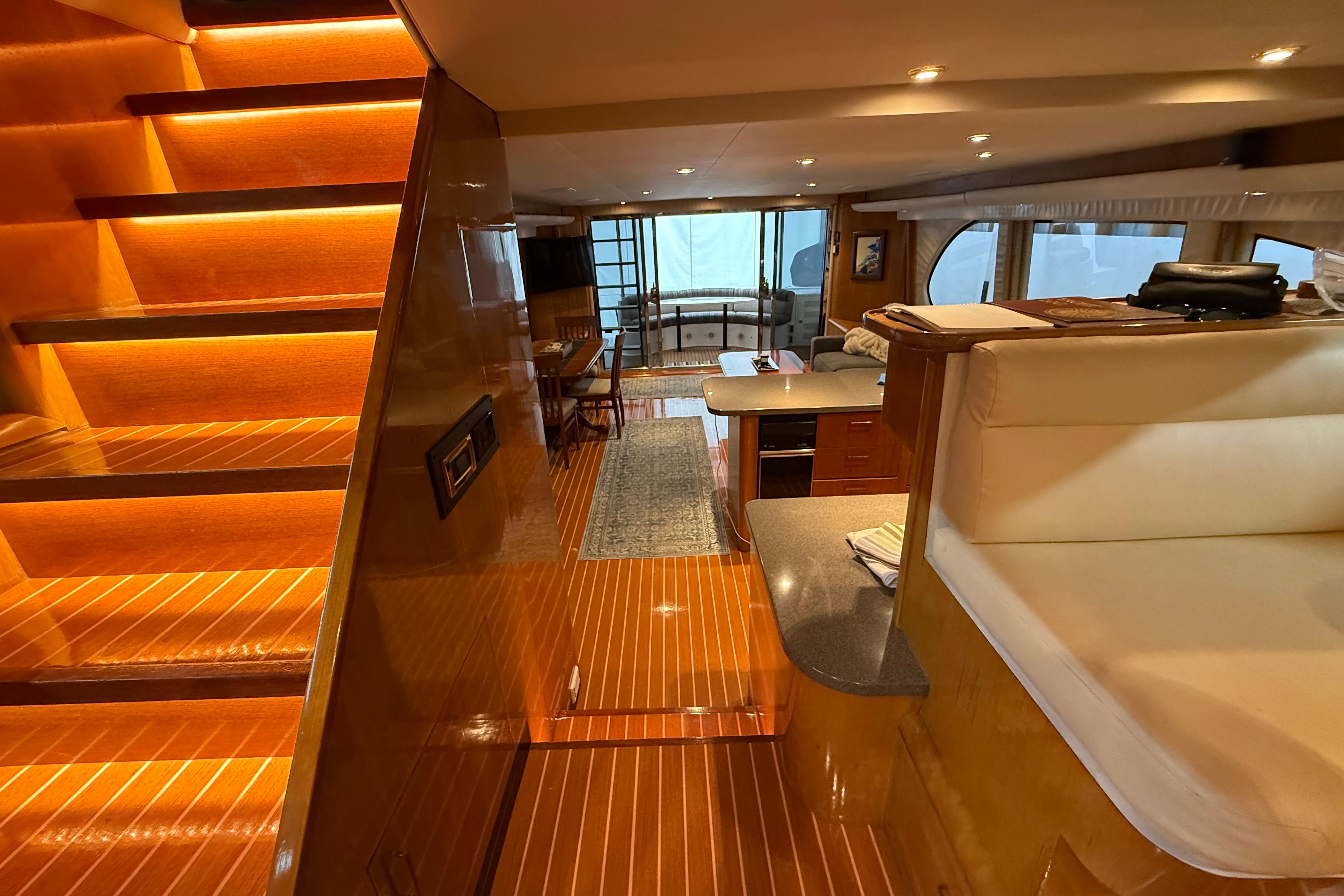 Luxurious interior of a 2000 Northern Pacific Motor Yacht with elegant wood finishes and modern amenities.