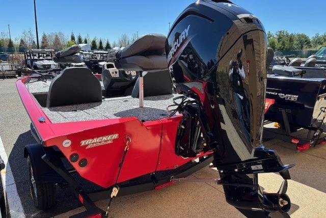 2026 Tracker Pro Team 175 boat with Mercury outboard motor, parked outdoors.