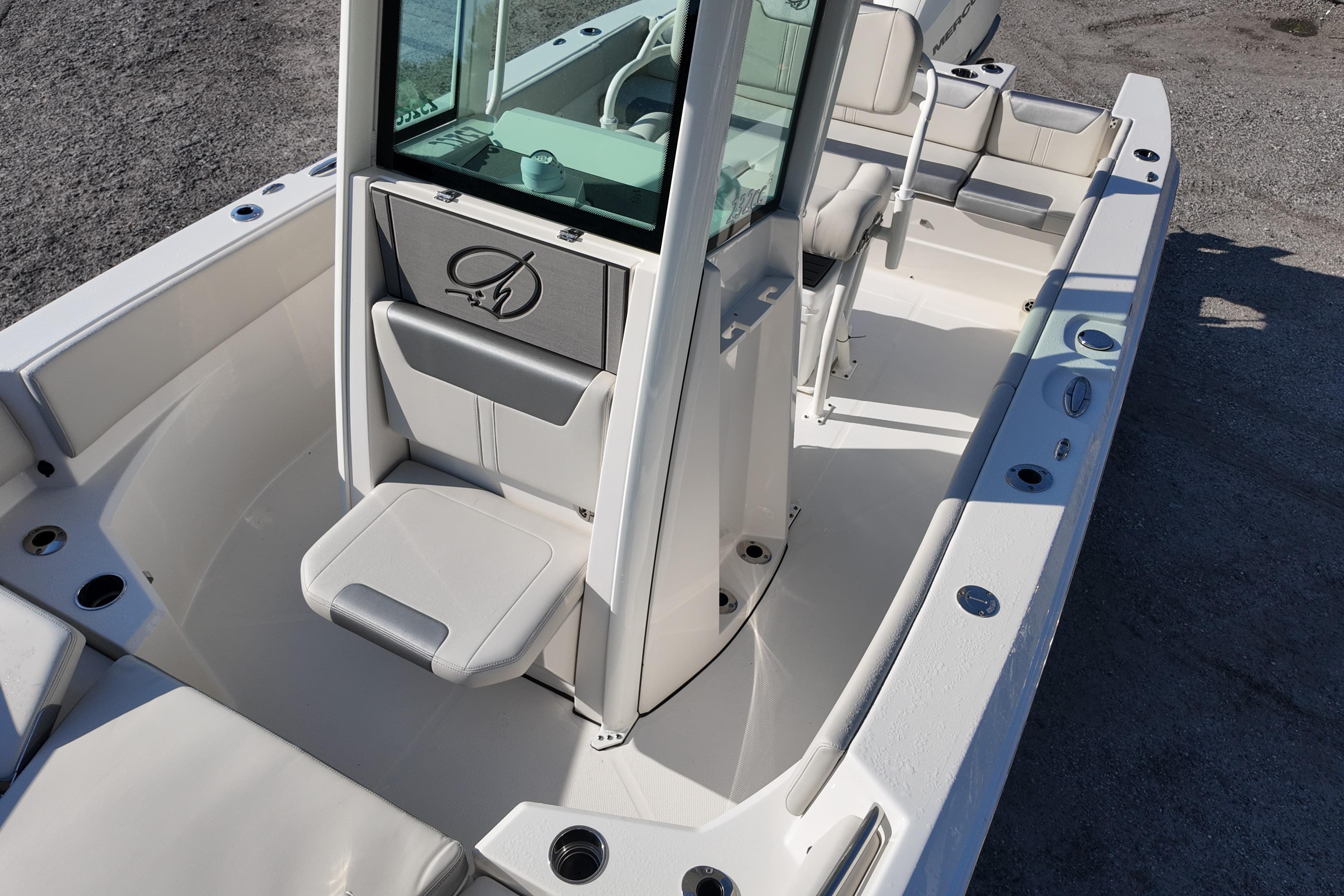 2026 Sailfish 232 CC boat interior with seating and console, showcasing modern design.