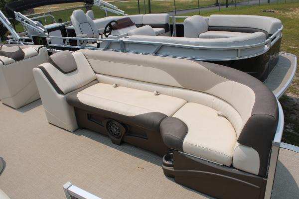 2021 Tahoe LTZ Cruise pontoon boat with beige and brown seating on deck.