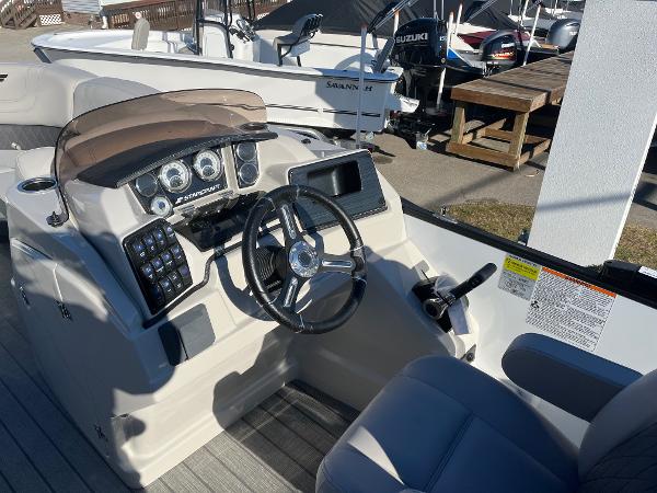 2024 Starcraft SLS3 boat dashboard with steering wheel and control panel.
