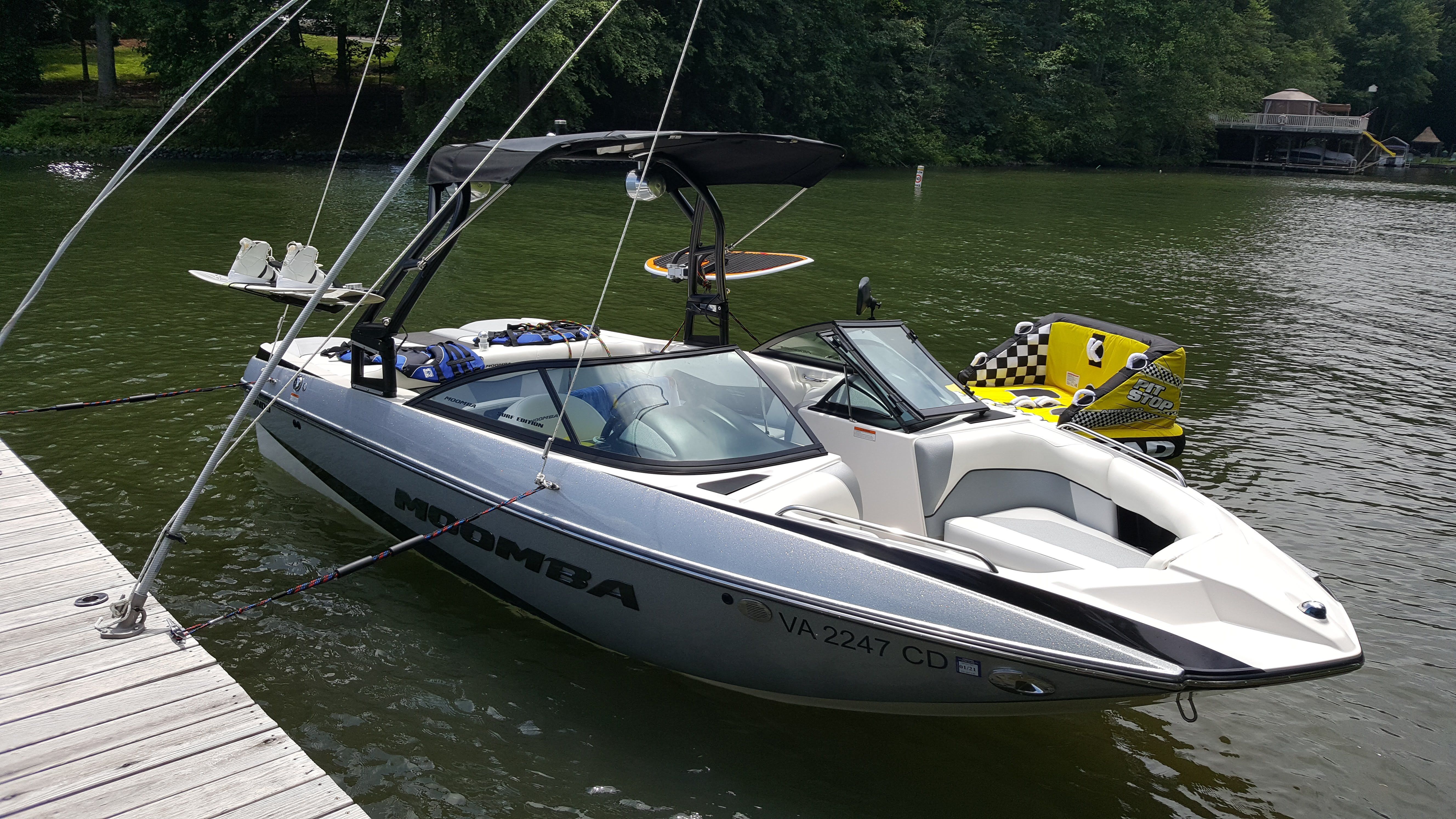 2016 Moomba Mondo at a lakeside dock with watersport gear.