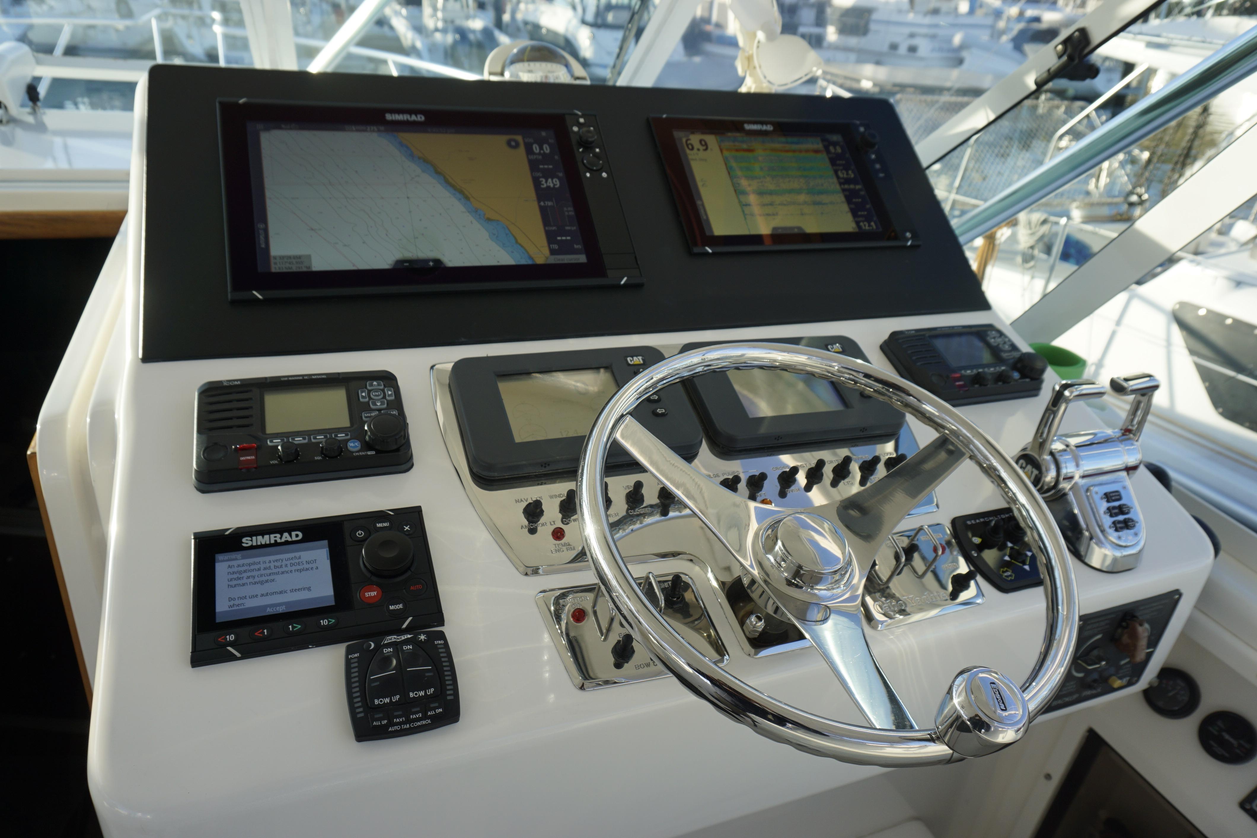 Control panel of 2005 Cabo 35 Express boat with navigation and communication equipment.