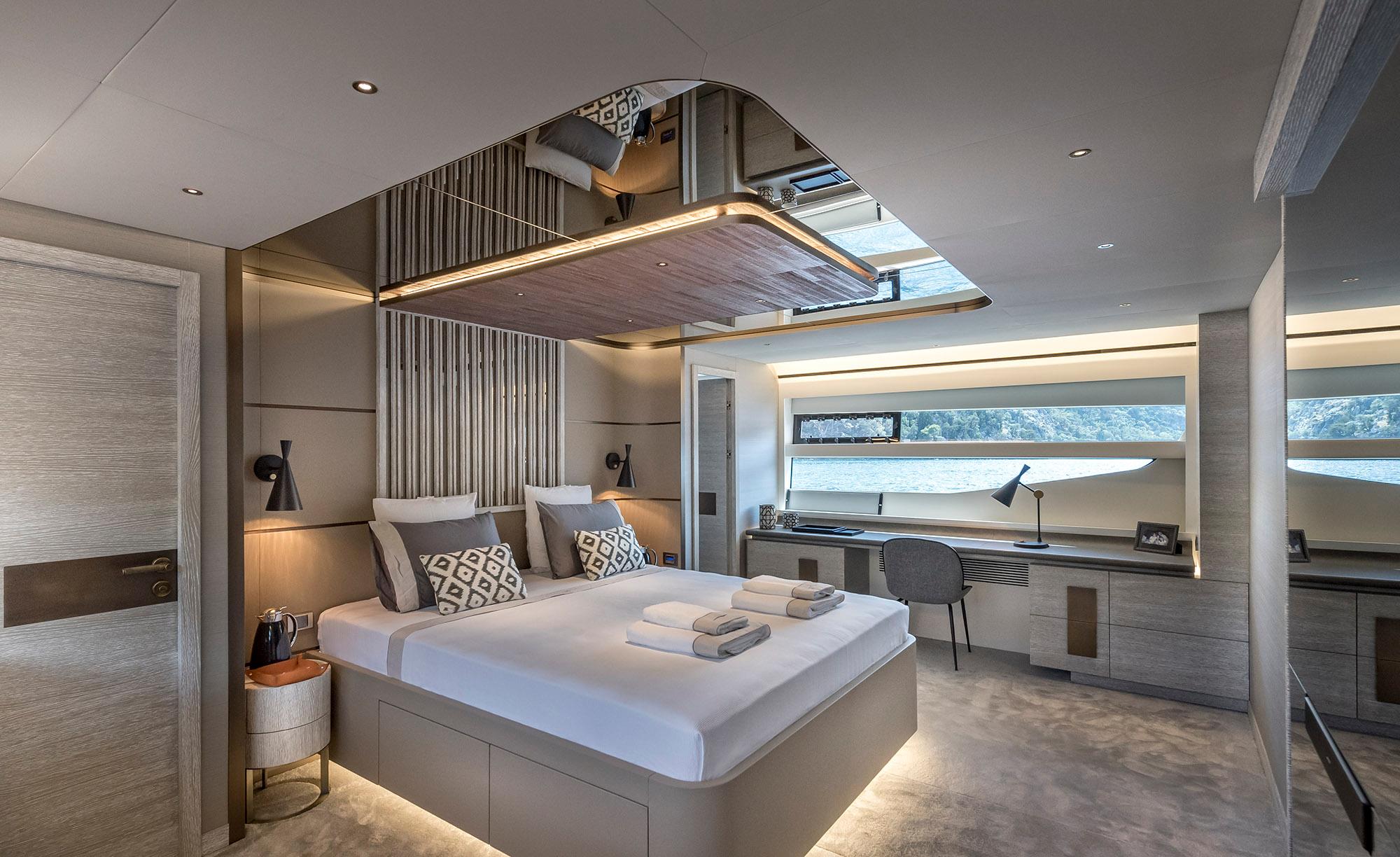 Luxurious bedroom interior on 2025 Numarine 26XP yacht, featuring modern design and elegant furnishings.