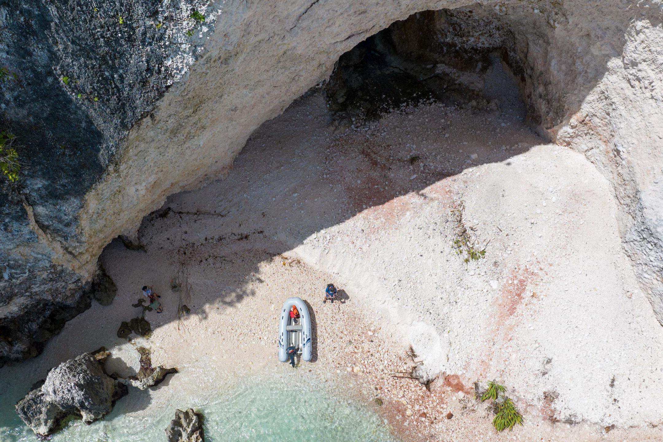 Aerial view of Highfield UltraLite 290LT boat on rocky shoreline.
