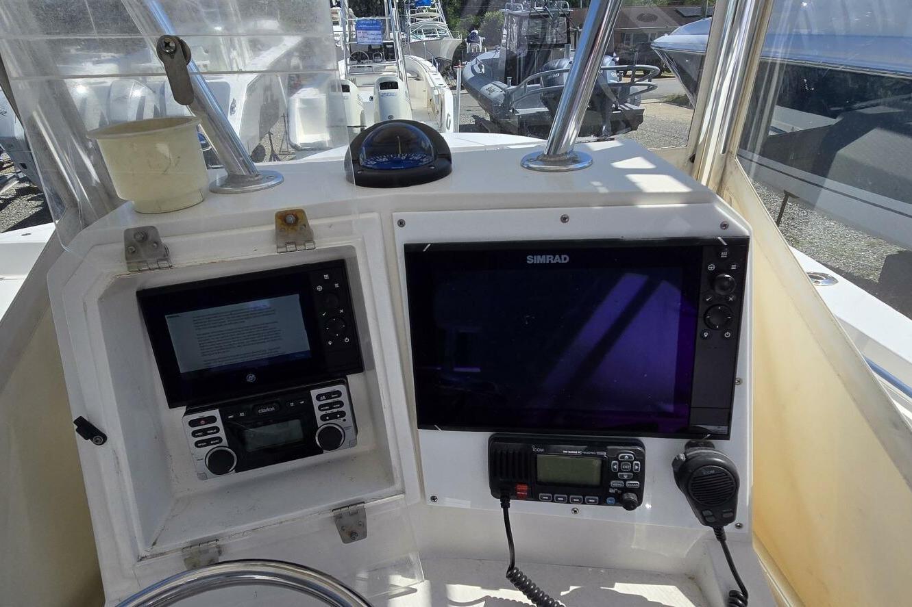 2008 Contender 23 Open boat dashboard with navigation and communication equipment.