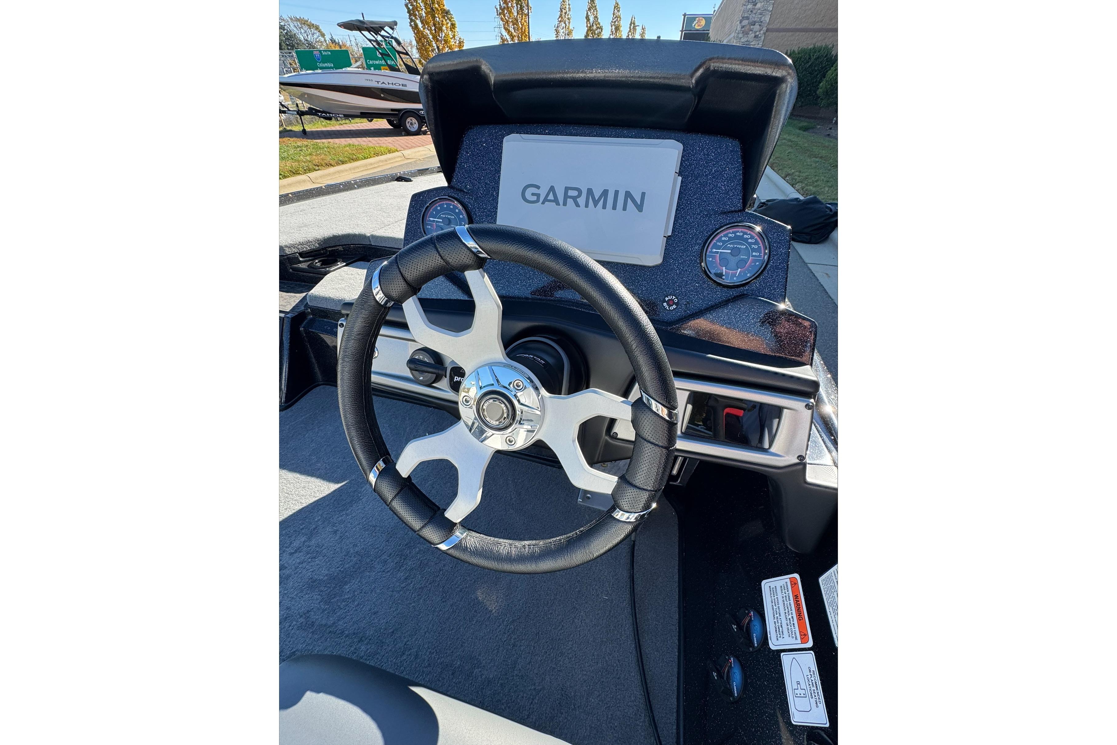 Steering wheel and Garmin display on 2026 Nitro Z20 XL Pro boat dashboard.